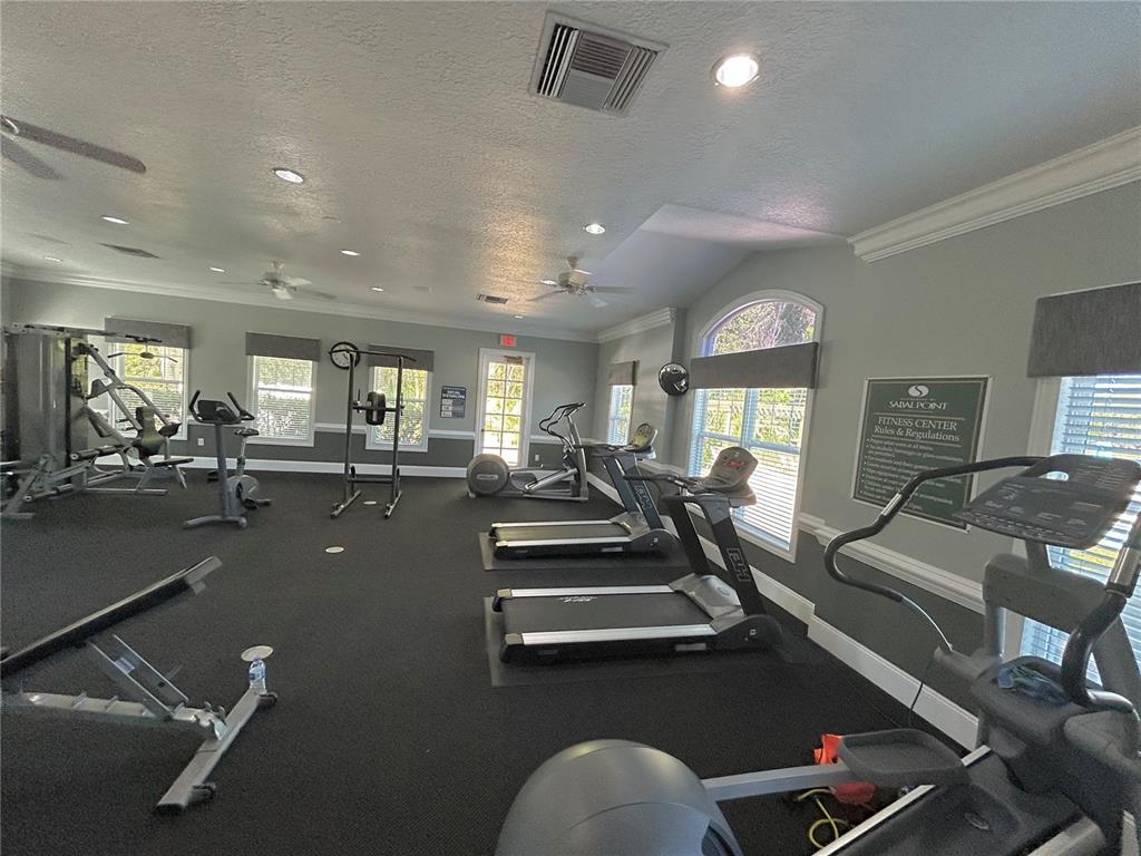 413 Summit Ridge Place, Unit 115 Longwood, FL 32779 - Photo 42 of 44 a view of a room with gym equipment