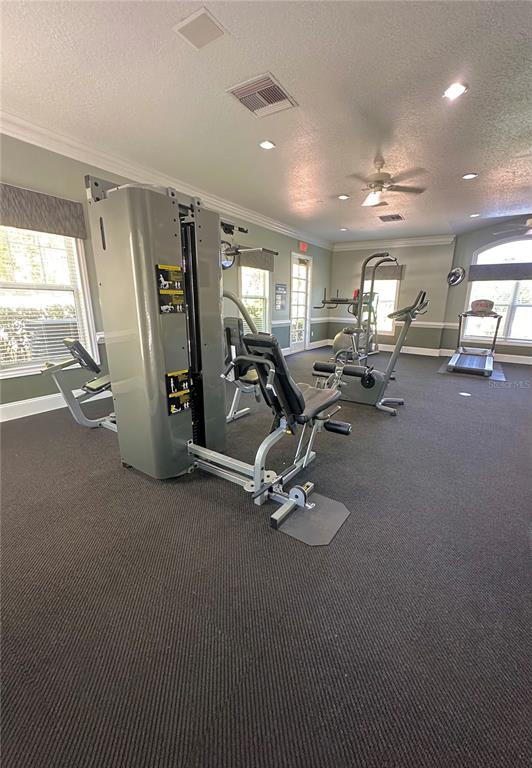 413 Summit Ridge Place, Unit 115 Longwood, FL 32779 - Photo 43 of 44 a view of a room with gym equipment