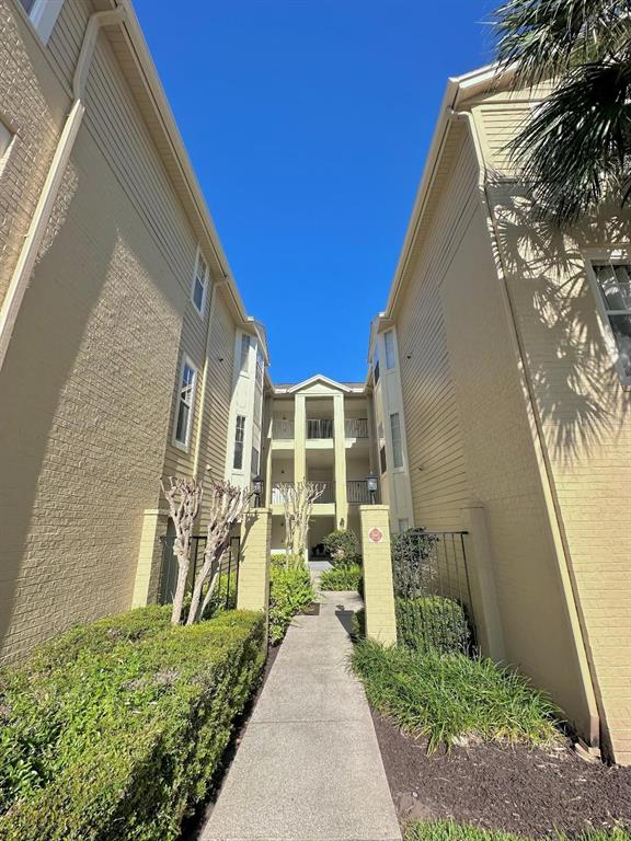 413 Summit Ridge Place, Unit 115 Longwood, FL 32779 - Photo 6 of 44 a view of a front of house with a yard