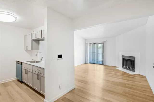 a view of a kitchen with furniture and a fireplace