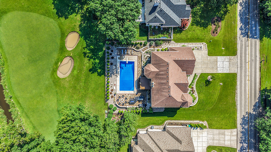 14151 131st Street Lemont, IL 60439 - Photo 20 of 62 an aerial view of a house with a swimming pool and outdoor seating