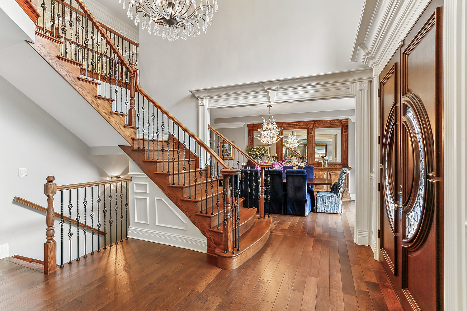 14151 131st Street Lemont, IL 60439 - Photo 22 of 62 a view of staircase with lots of frames on wall and wooden floor