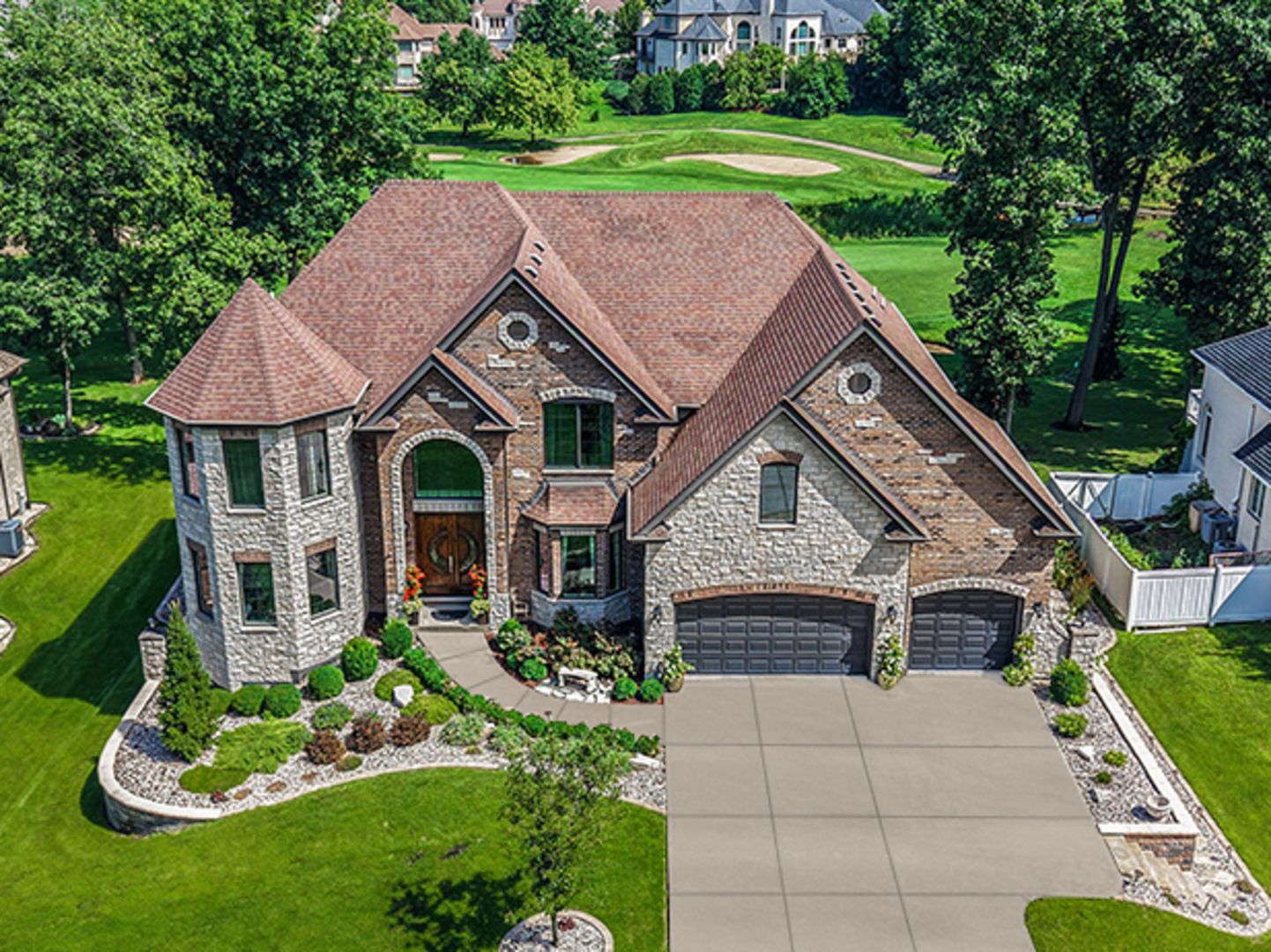 14151 131st Street Lemont, IL 60439 - Photo 3 of 62 a aerial view of a house with a yard table and chairs