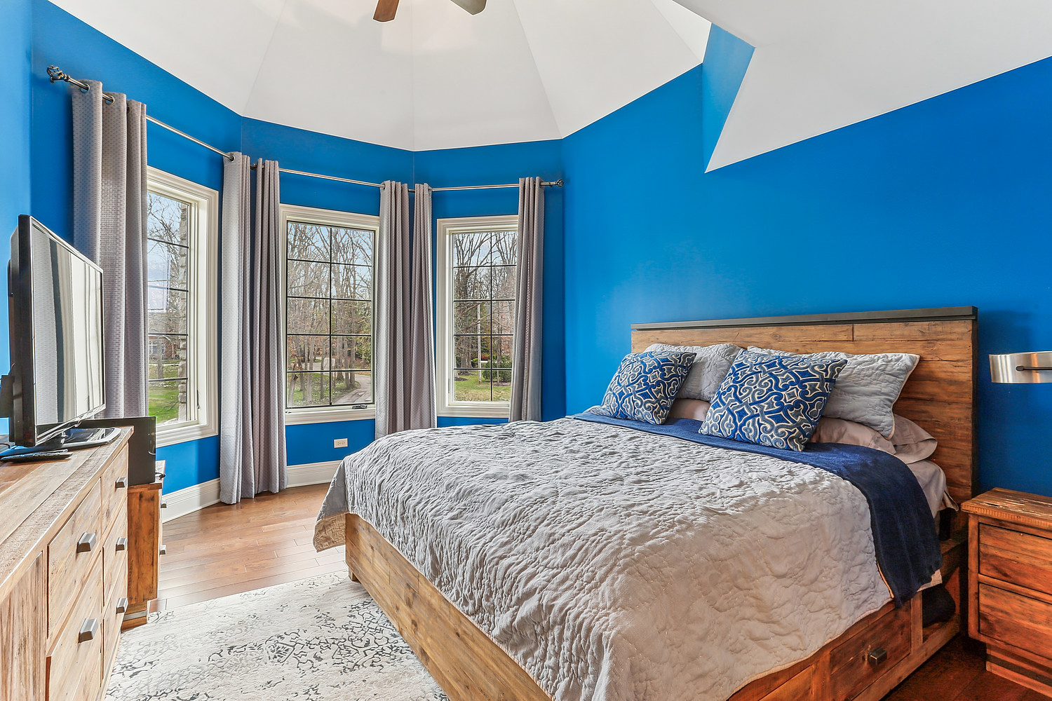 14151 131st Street Lemont, IL 60439 - Photo 52 of 62 a large bed sitting in a bedroom next to a window