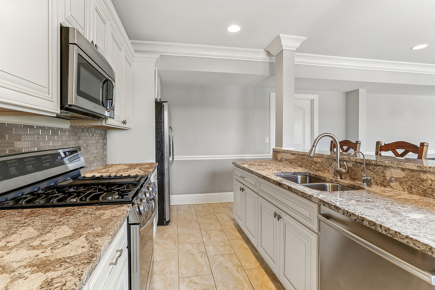 14151 131st Street Lemont, IL 60439 - Photo 57 of 62 a kitchen with stainless steel appliances granite countertop a sink and a stove