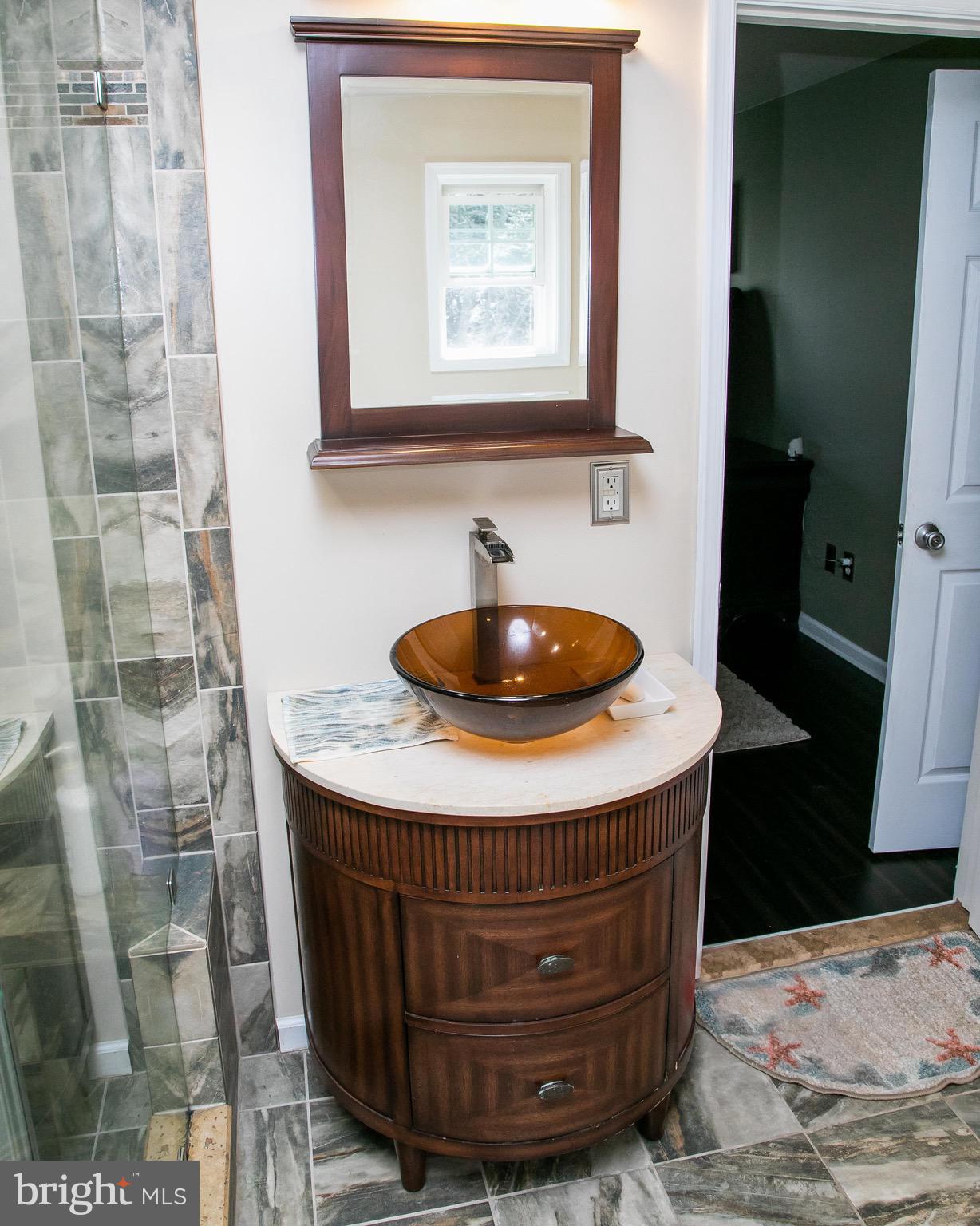 4299 Allen Road Eden, MD 21822 - Photo 35 of 54 a bathroom with a sink a mirror and shower