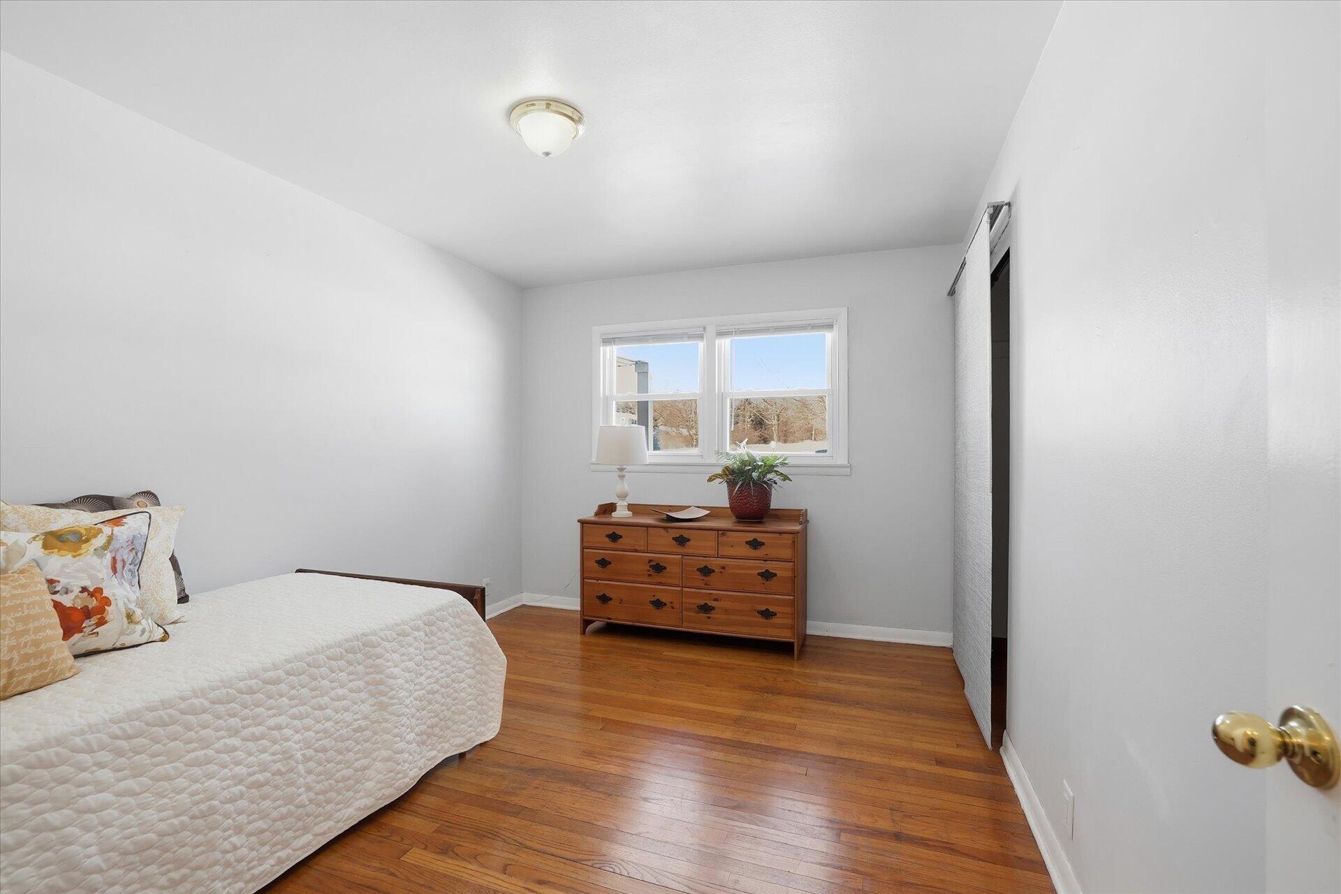 2330 South Sunny Slope Road New Berlin, WI 53151 - Photo 22 of 28 3rd Bedroom with Hardwood Floors