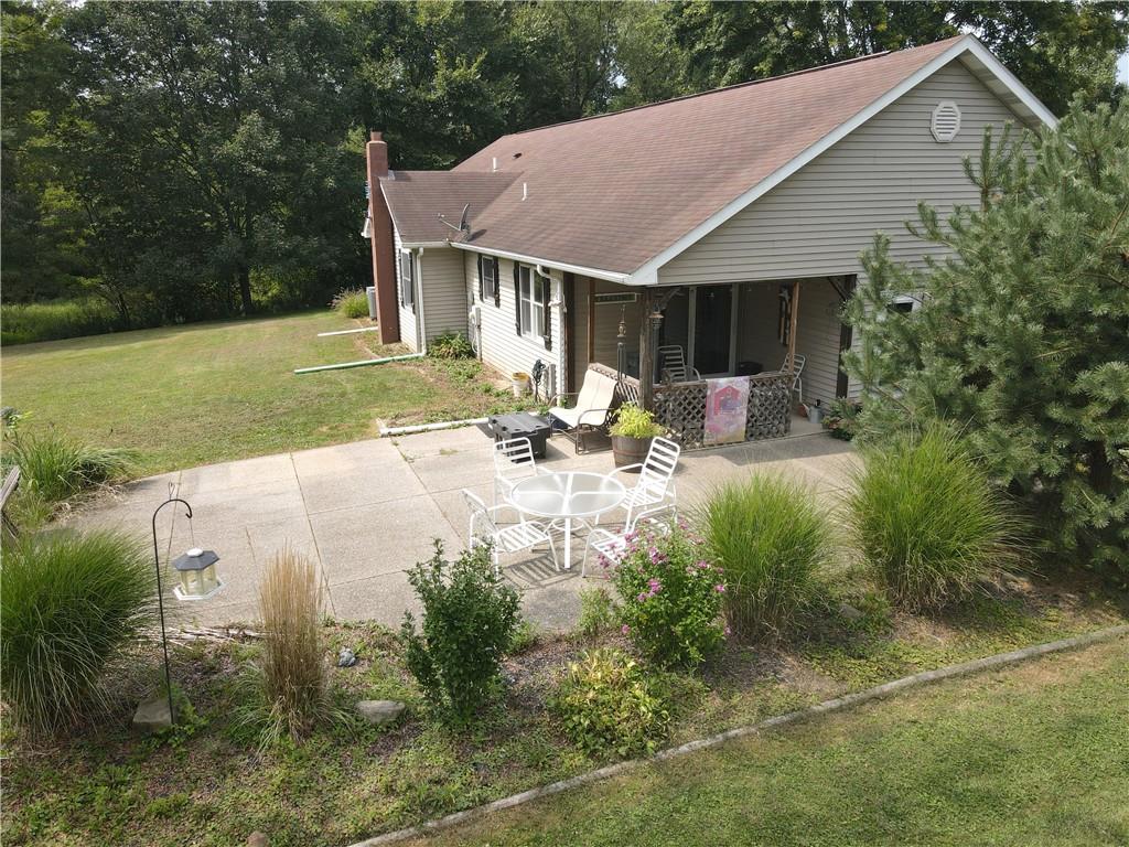 2509 Old Enon Unity Road Enon Valley, PA 16120 - Photo 16 of 19 a view of a house with backyard and sitting area