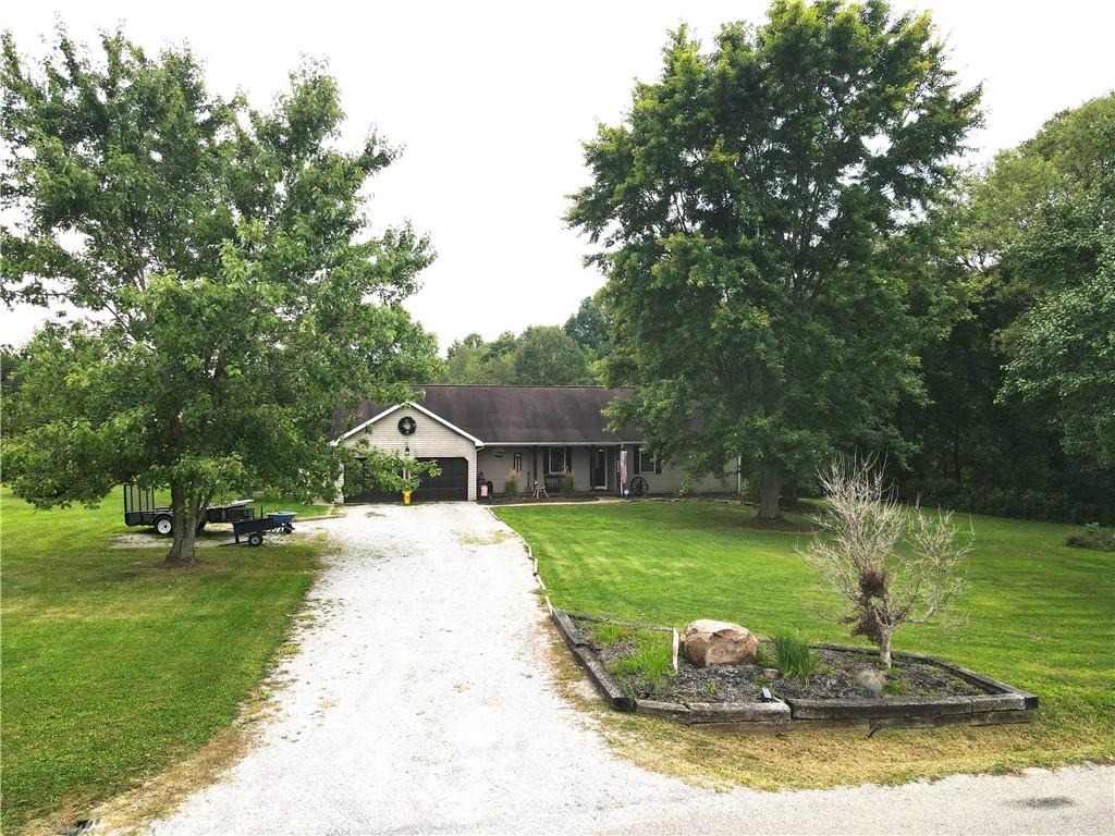 2509 Old Enon Unity Road Enon Valley, PA 16120 - Photo 2 of 19 a view of a house with a yard porch and sitting area