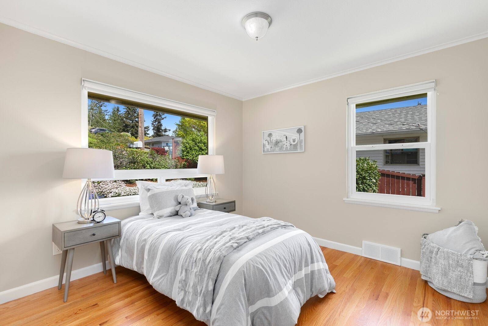 1429 Southwest 170th Street Normandy Park, WA 98166 - Photo 18 of 31 a bedroom with a bed and wooden floor