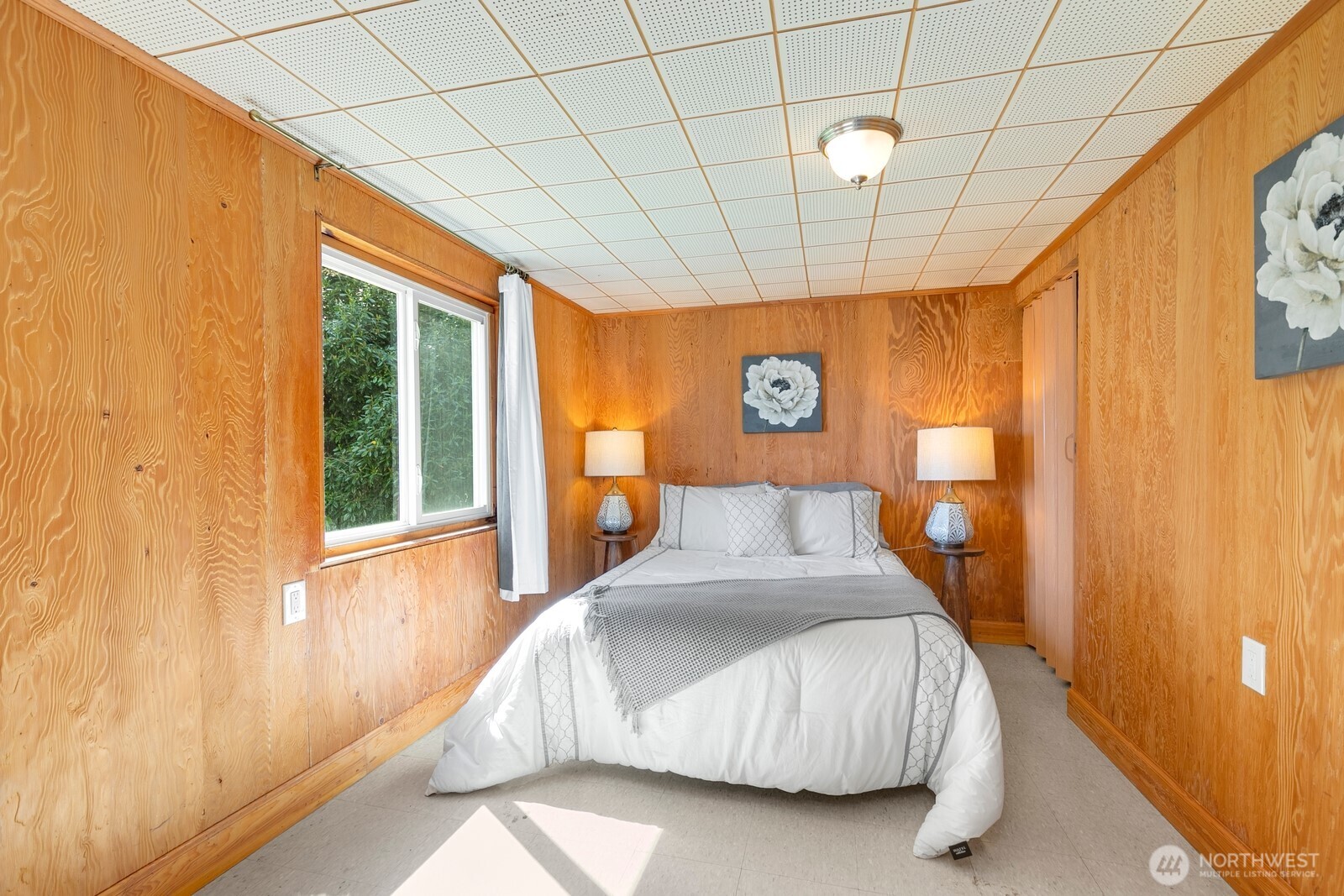 1429 Southwest 170th Street Normandy Park, WA 98166 - Photo 22 of 31 a bedroom with a bed and a window