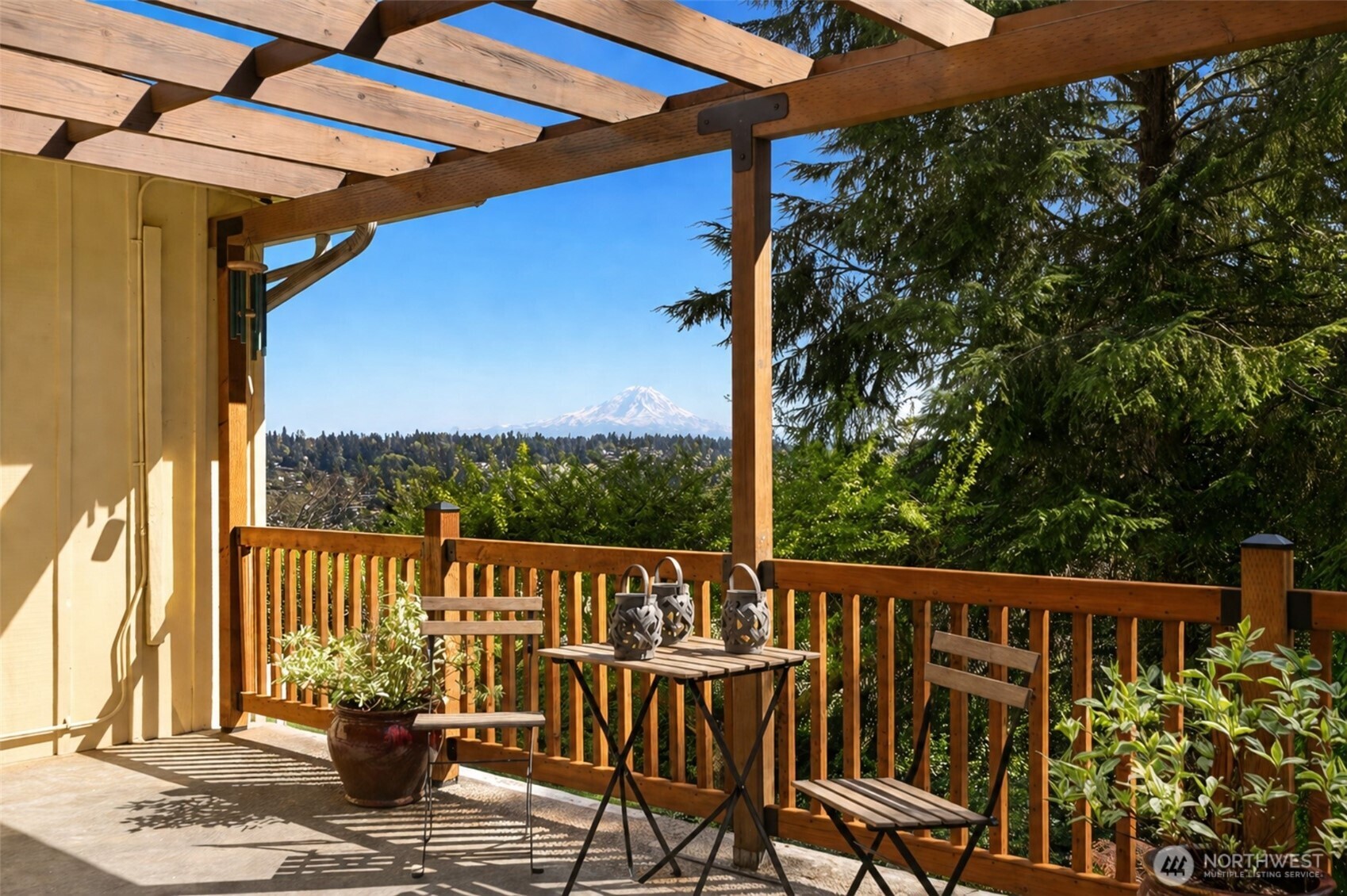 1429 Southwest 170th Street Normandy Park, WA 98166 - Photo 23 of 31 a view of a chair and tables the patio of the house