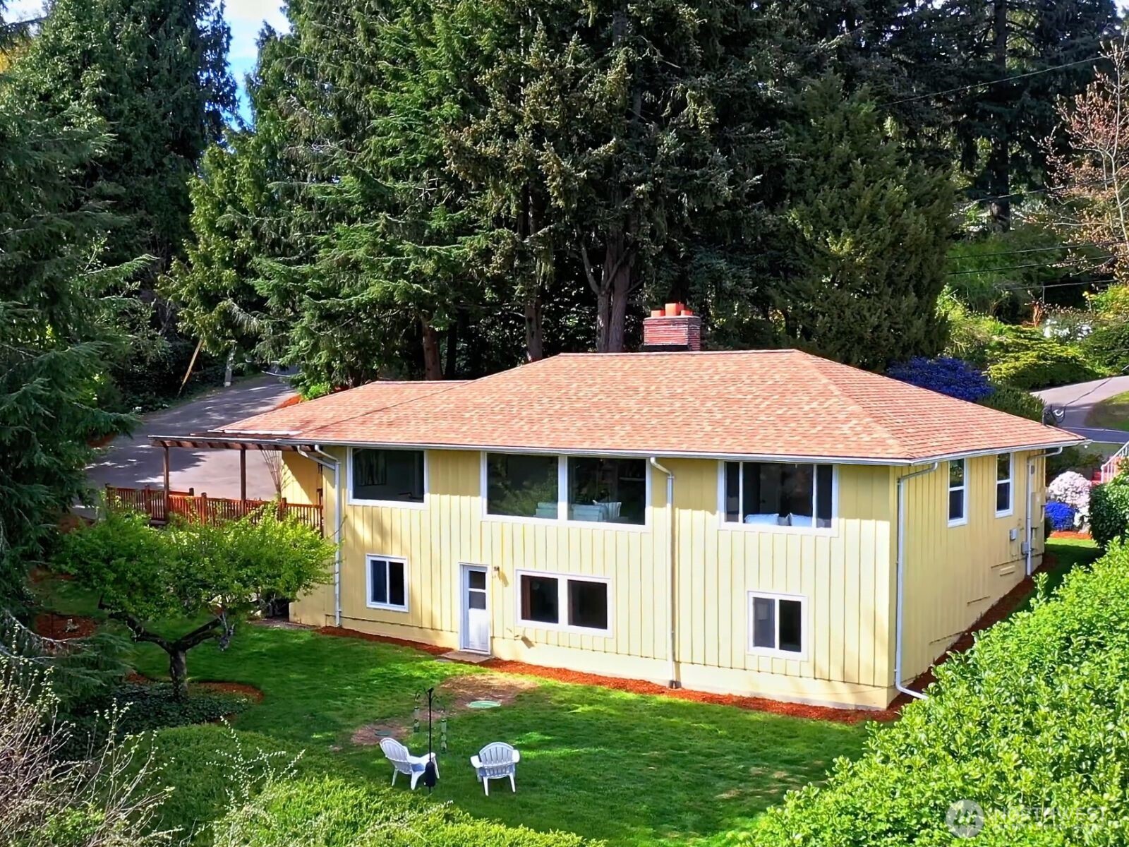 1429 Southwest 170th Street Normandy Park, WA 98166 - Photo 3 of 31 a view of a white house with a big yard plants and large trees