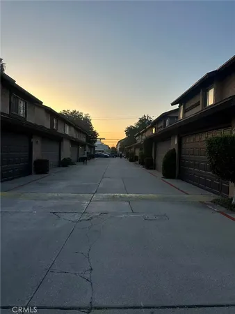 a backyard of a house with wooden fence