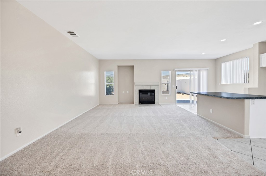 43850 Tiber Street Hemet, CA 92544 - Photo 13 of 39 a view of empty room with a kitchen and window