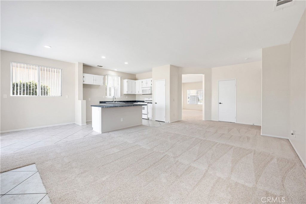 43850 Tiber Street Hemet, CA 92544 - Photo 15 of 39 a view of a kitchen with a sink cabinets and a window