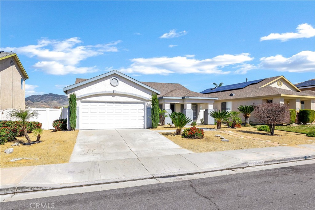 43850 Tiber Street Hemet, CA 92544 - Photo 2 of 39 a view of a house with entertaining space and a car parked in front of it