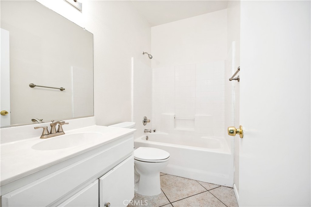 43850 Tiber Street Hemet, CA 92544 - Photo 31 of 39 a bathroom with a sink a toilet and shower