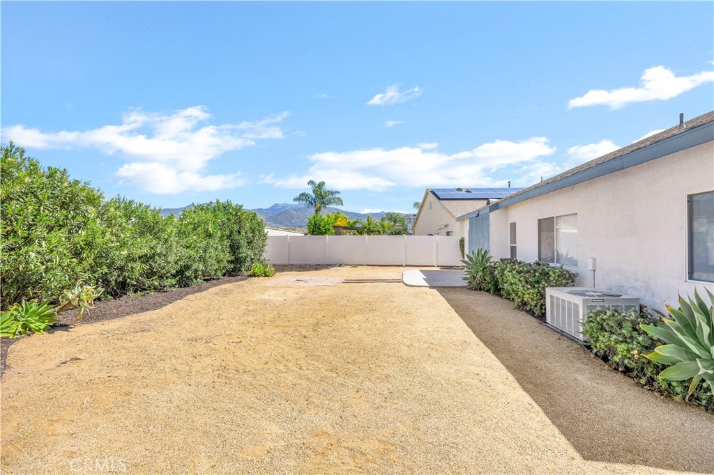 43850 Tiber Street Hemet, CA 92544 - Photo 38 of 39 a front view of a house with a yard and table and chairs
