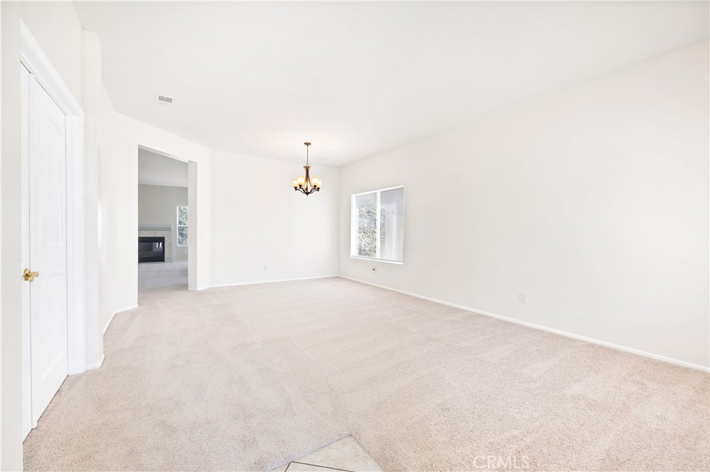 43850 Tiber Street Hemet, CA 92544 - Photo 6 of 39 a view of an empty room with a window