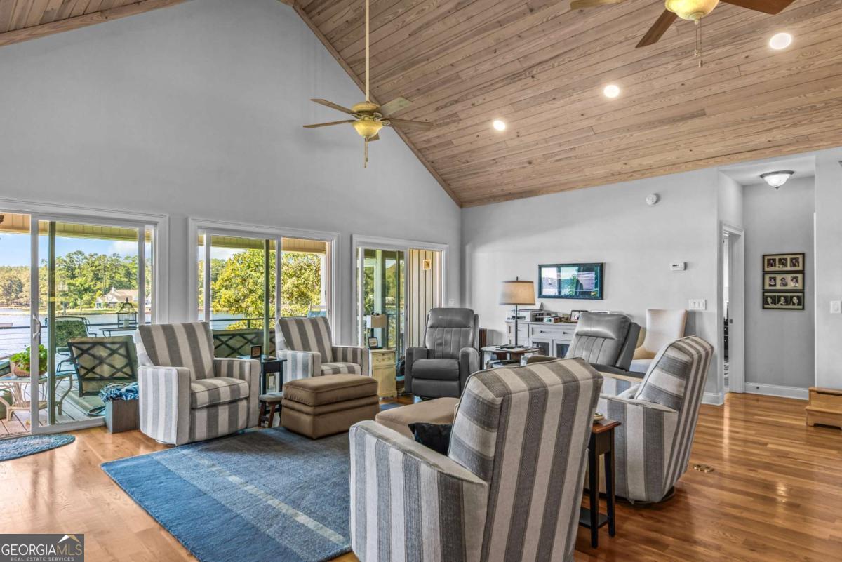 114 Sinclair Lane Eatonton, GA 31024 - Photo 15 of 76 a living room with furniture window and wooden floor