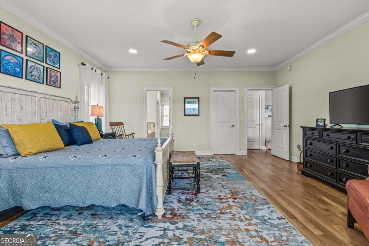 114 Sinclair Lane Eatonton, GA 31024 - Photo 30 of 76 a living room with furniture and a flat screen tv