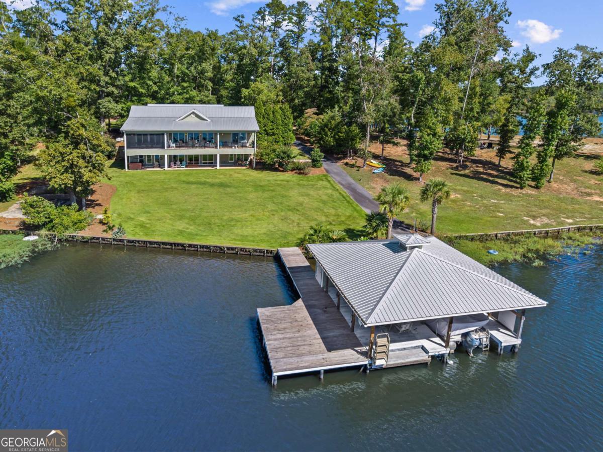 114 Sinclair Lane Eatonton, GA 31024 - Photo 45 of 76 a view of a house with pool and a yard