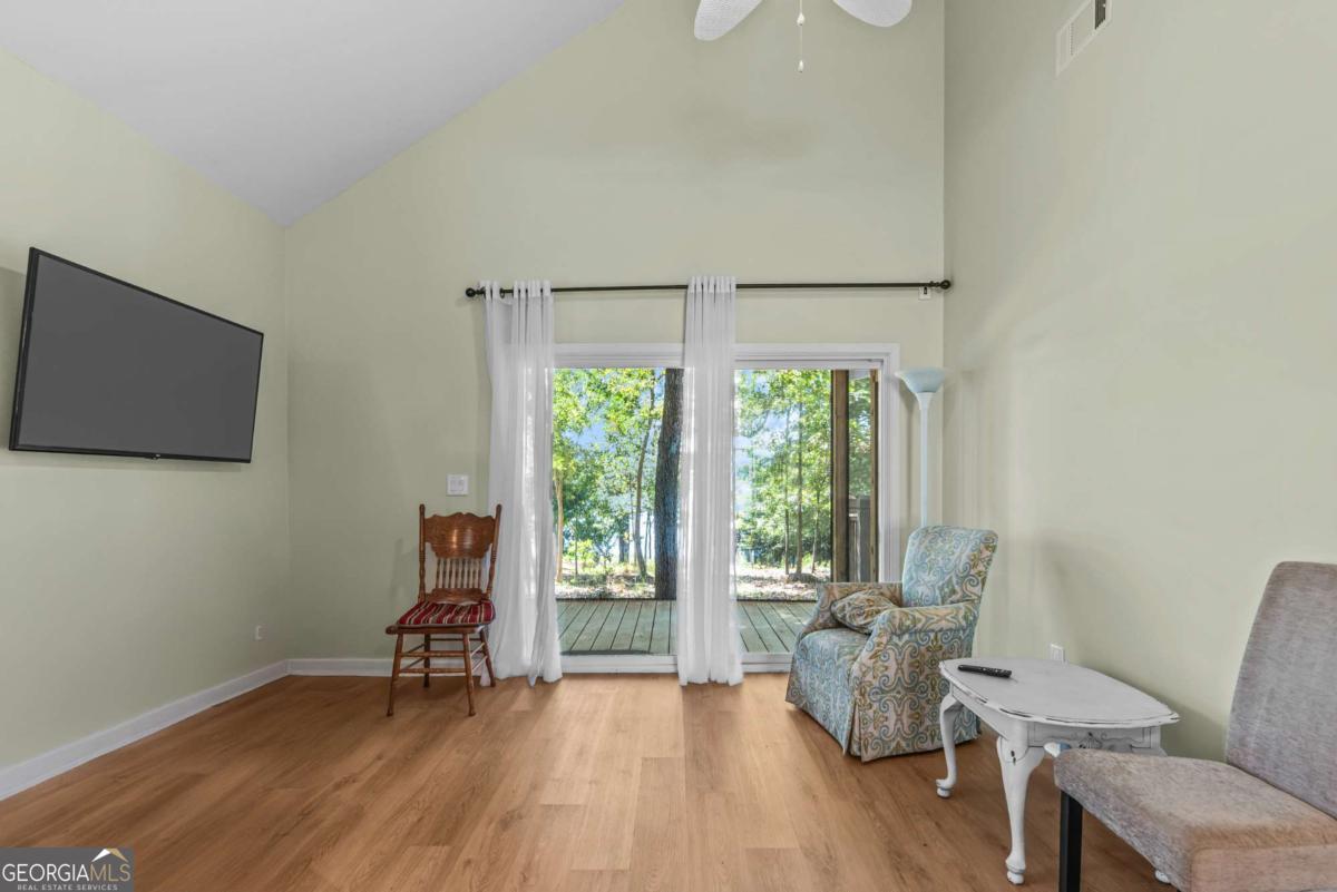 114 Sinclair Lane Eatonton, GA 31024 - Photo 72 of 76 a living room with furniture and a large window