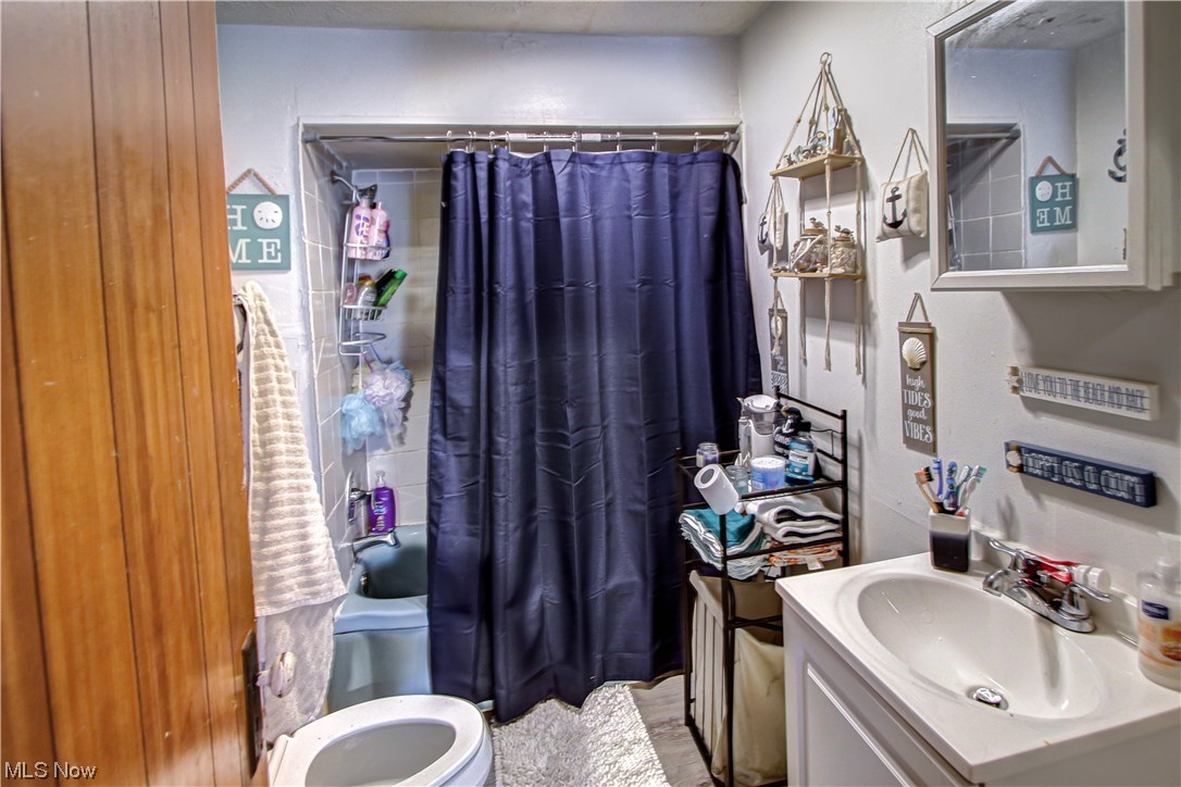 3816 Riverside Avenue Cleveland, OH 44109 - Photo 28 of 35 1st floor Bathroom featuring vanity with extensive cabinet space and mirror