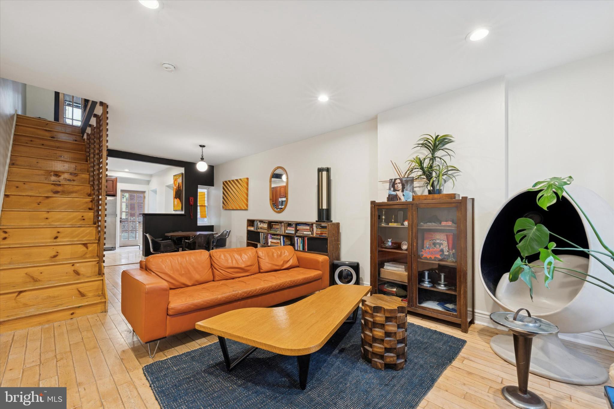 2540 Collins Street Philadelphia, PA 19125 - Photo 2 of 15 a living room with furniture a rug and a chandelier