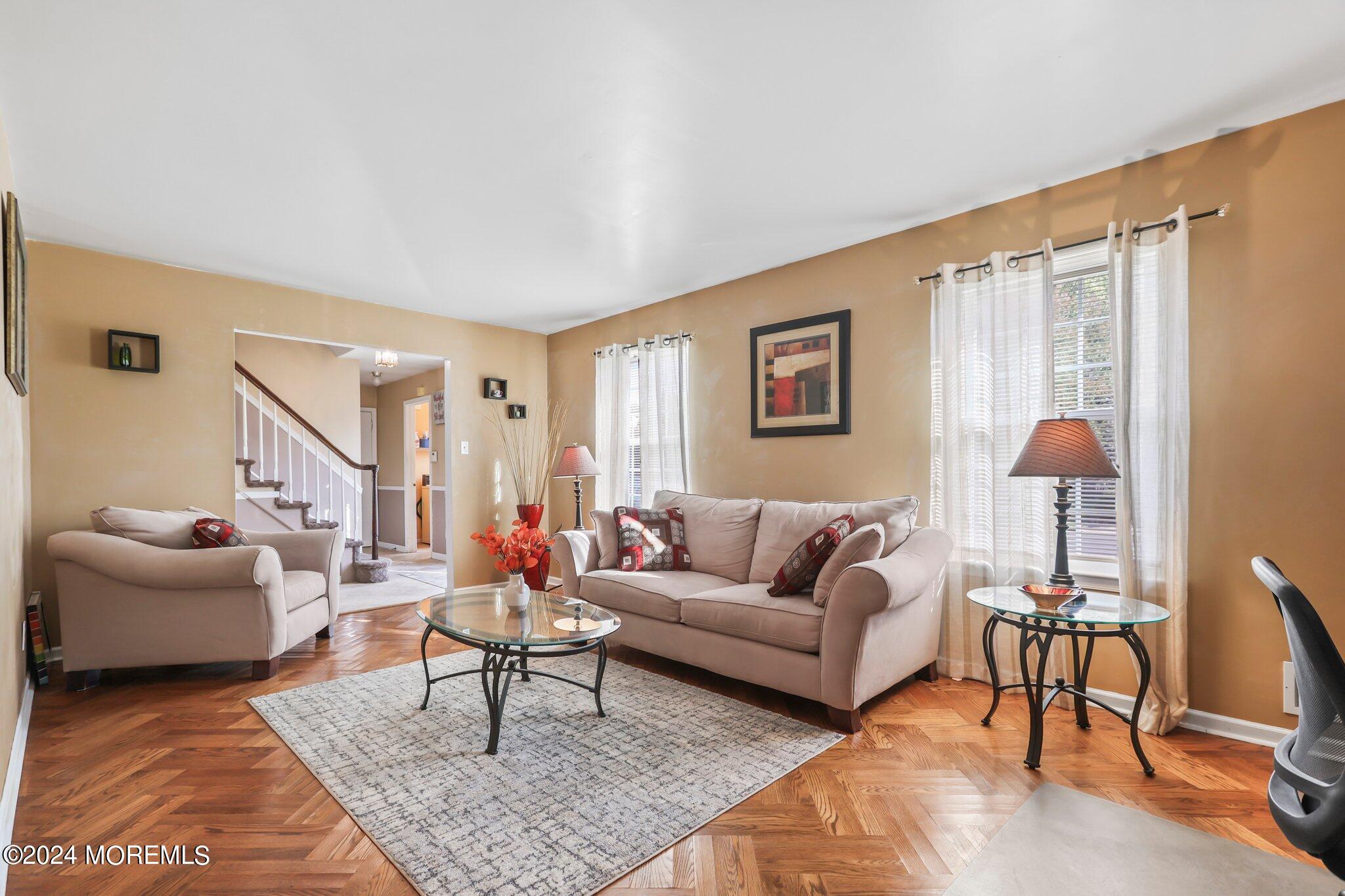 14 Cherry Bend Drive Howell, NJ 07731 - Photo 11 of 47 a living room with furniture a rug and a large window