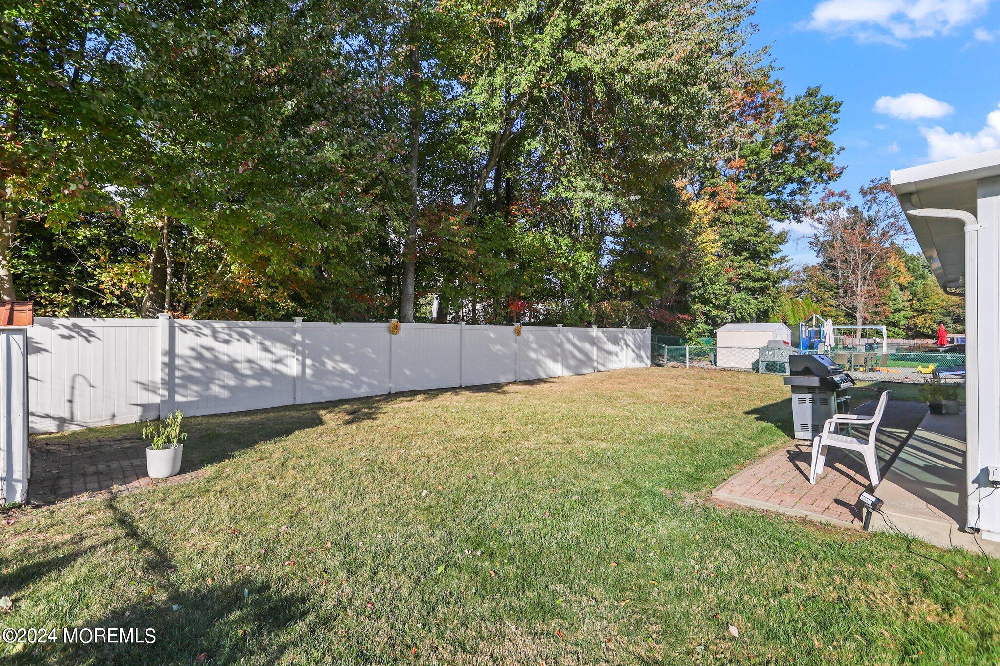 14 Cherry Bend Drive Howell, NJ 07731 - Photo 24 of 47 a view of a backyard with sitting area