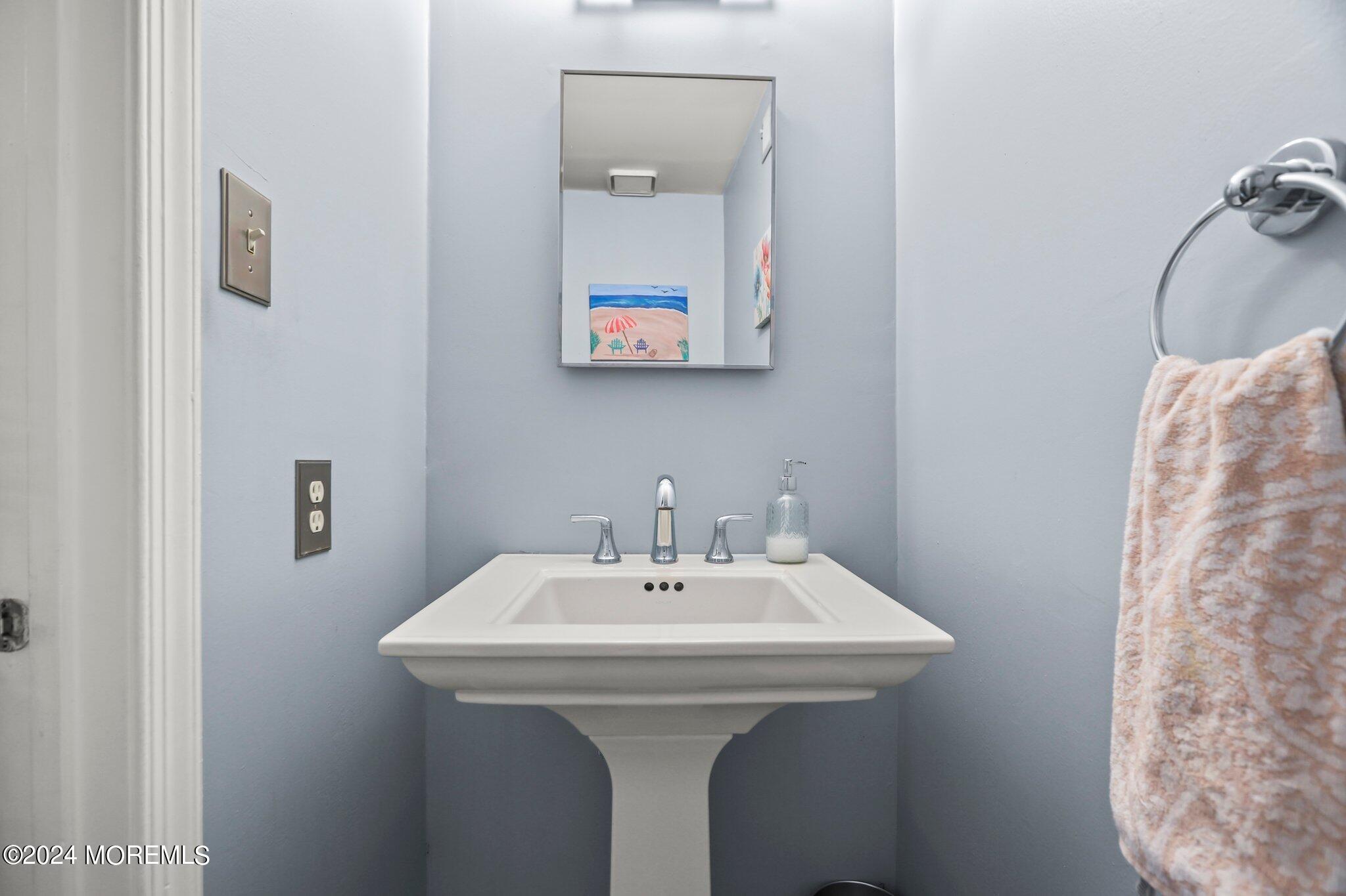 14 Cherry Bend Drive Howell, NJ 07731 - Photo 26 of 47 a bathroom with a sink and a mirror