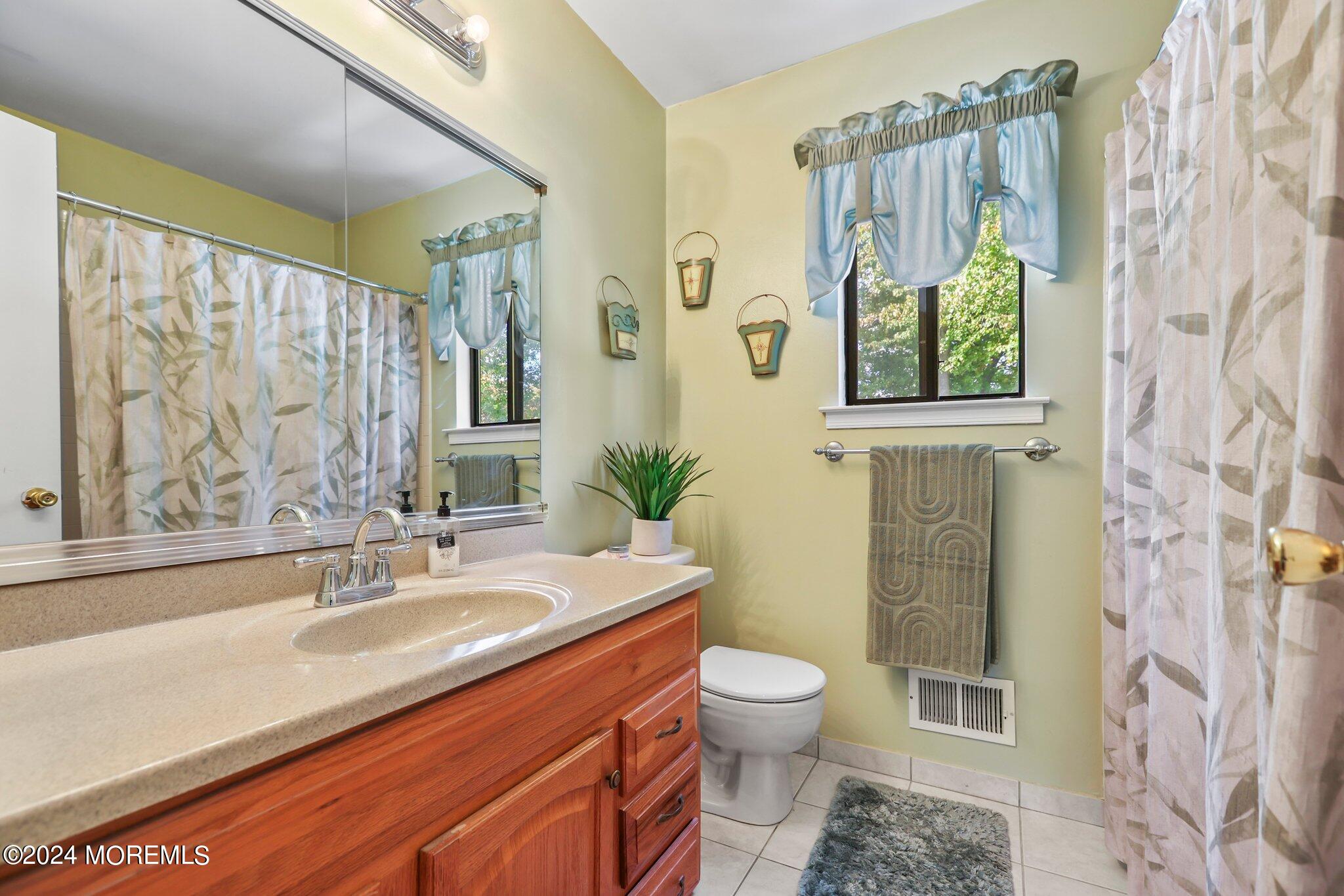 14 Cherry Bend Drive Howell, NJ 07731 - Photo 29 of 47 a bathroom with a granite countertop sink a toilet and a shower