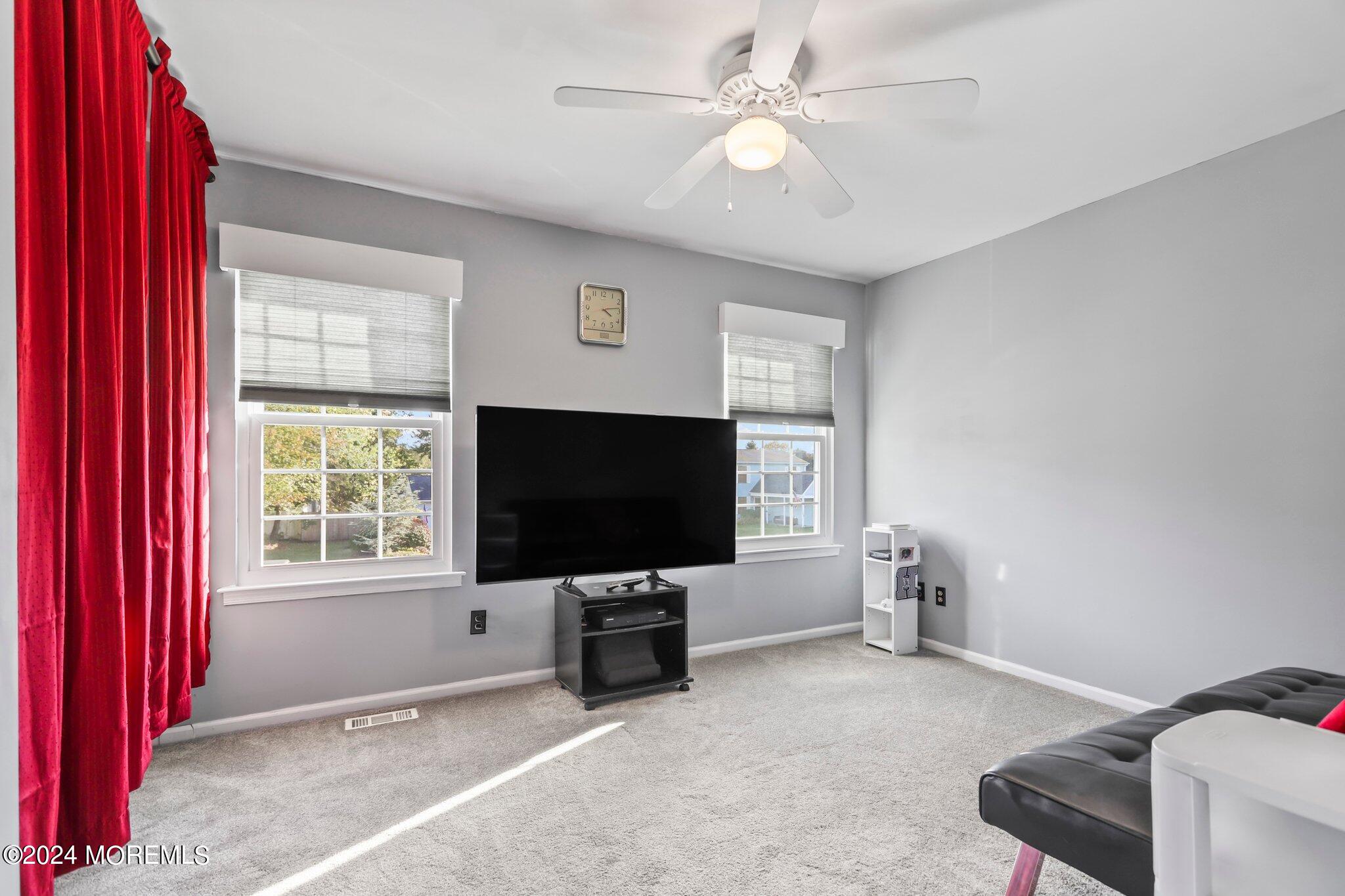 14 Cherry Bend Drive Howell, NJ 07731 - Photo 30 of 47 a living room with furniture and a flat screen tv