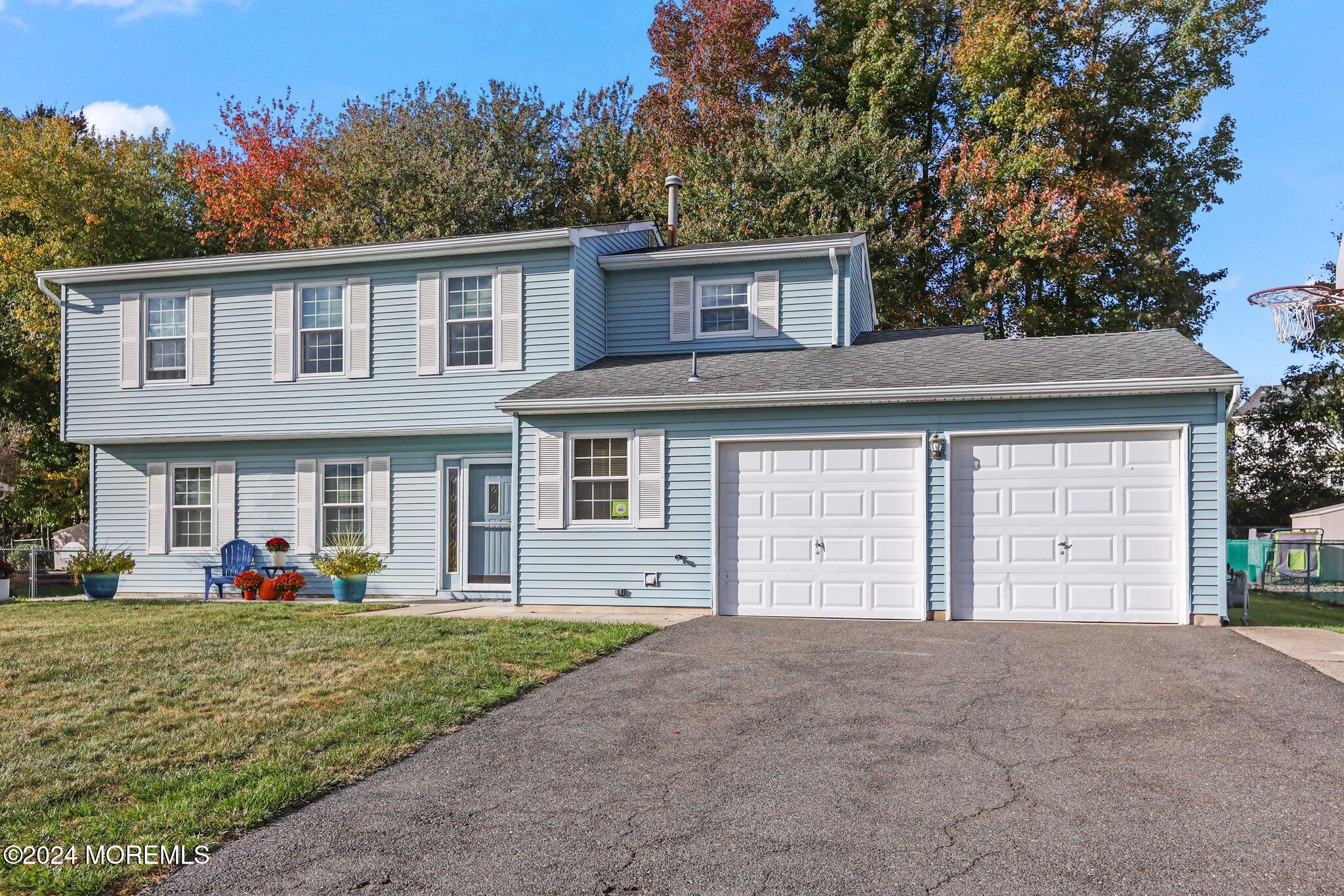 14 Cherry Bend Drive Howell, NJ 07731 - Photo 4 of 47 a front view of a house with garden