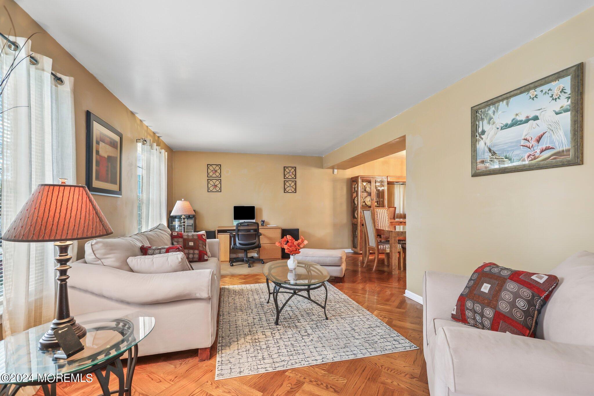 14 Cherry Bend Drive Howell, NJ 07731 - Photo 10 of 47 a living room with furniture and a lamp