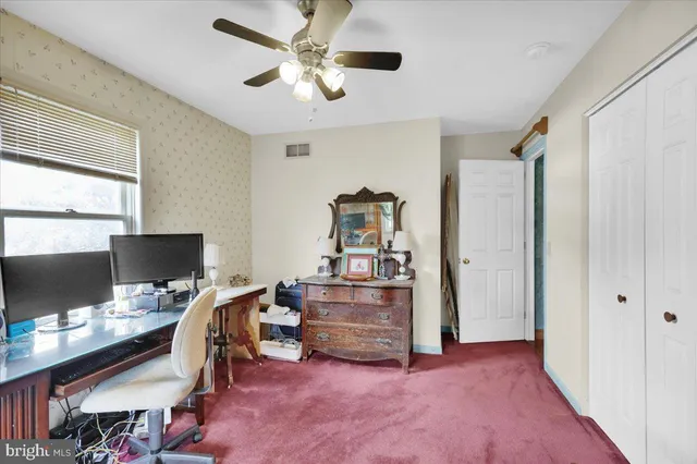 a workspace with furniture and window