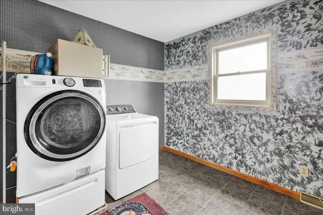 a utility room with dryer and washer