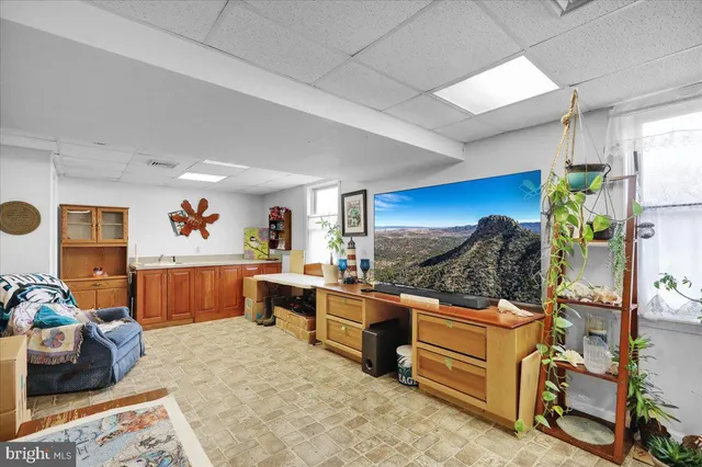 a view of a living room kitchen and a window