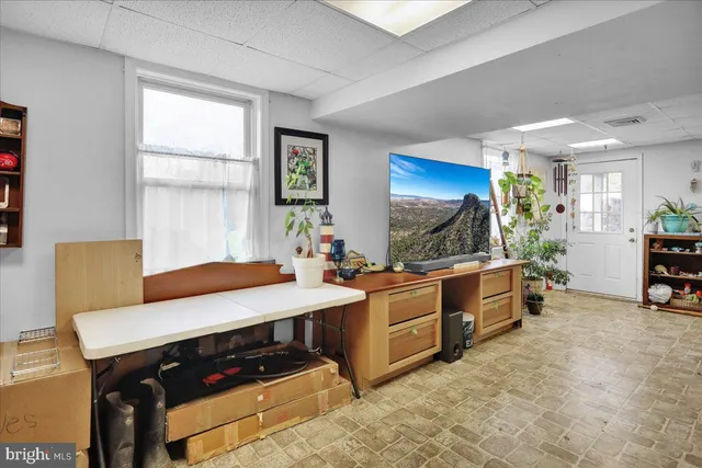 a kitchen with stainless steel appliances a stove a sink and a refrigerator