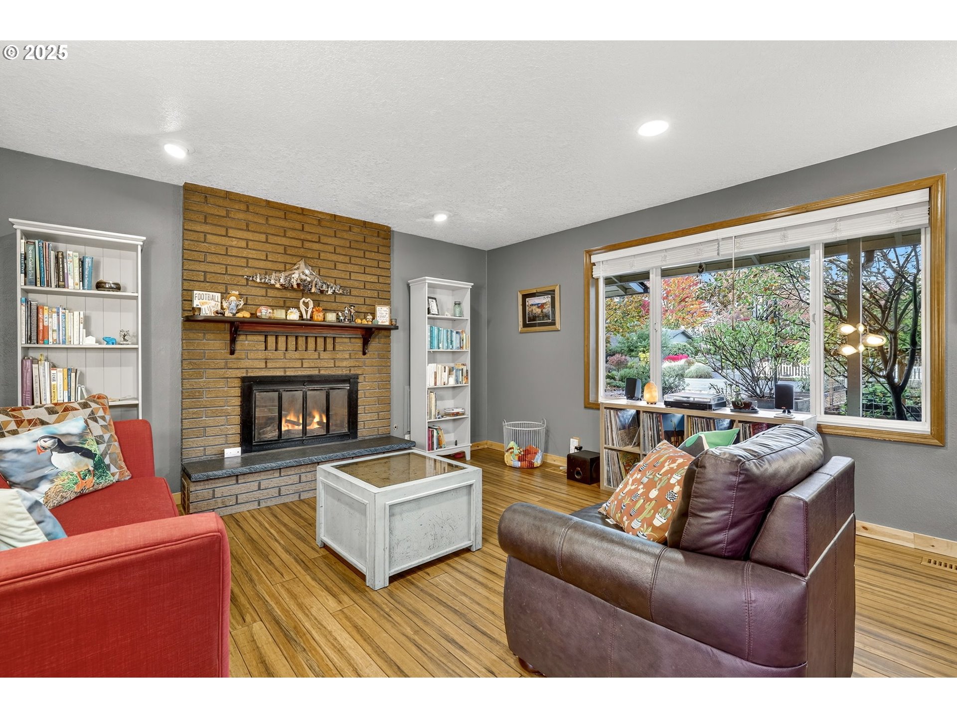 814 Cedaroak Street St. Helens, OR 97051 - Photo 11 of 43 a living room with furniture a large window and a fireplace