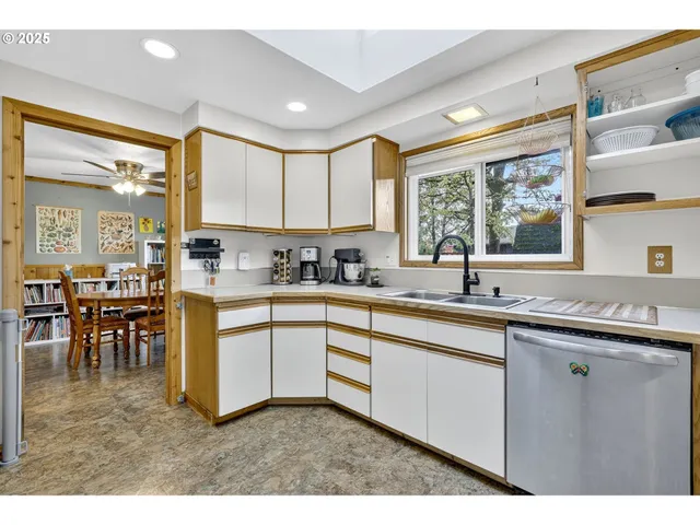 a kitchen with lots of counter top space and dining table