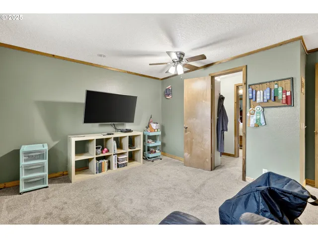a view of a livingroom with furniture and a flat screen tv