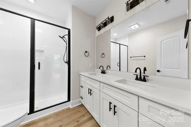 a bathroom with a double vanity sink mirror and double