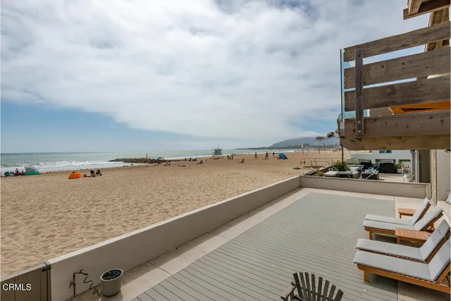 a living room with furniture and white walls
