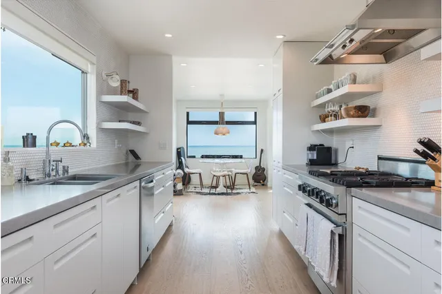 a view of a balcony with chair and wooden floor
