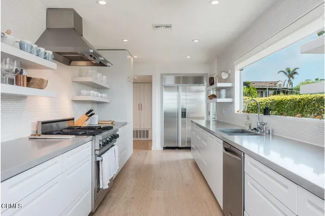 a bathroom with a double vanity sink and mirror