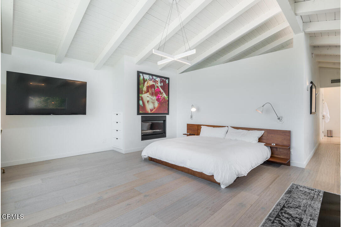 998 Sharon Lane Ventura, CA 93001 - Photo 24 of 42 a large bedroom with a bed and a flat screen tv