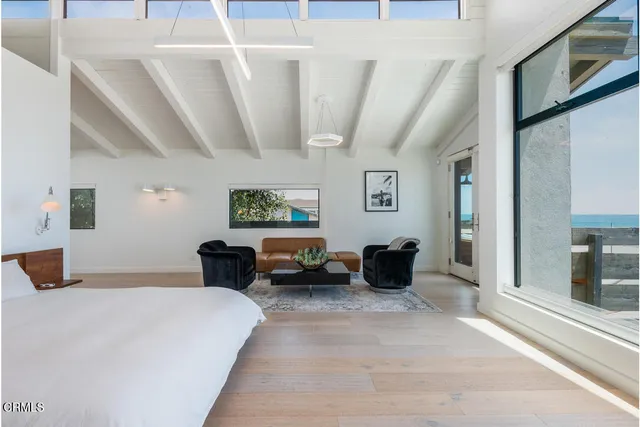 a bathroom with a granite countertop sink toilet and mirror